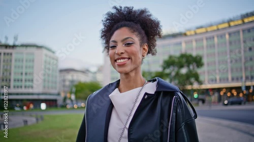 Wallpaper Mural Gorgeous girl strolling street with wind blown curly hair closeup. African woman Torontodigital.ca