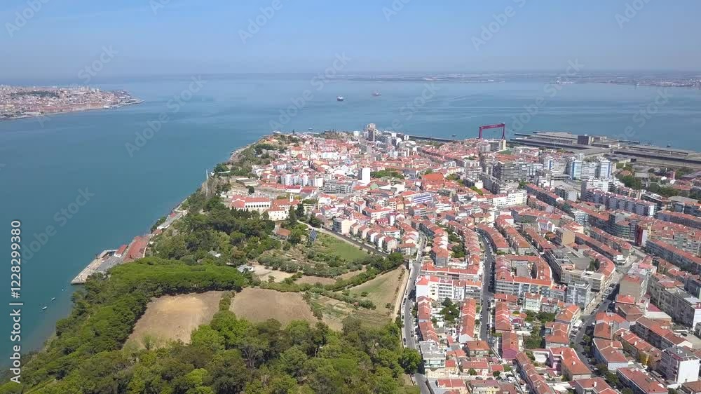 LISBON, PORTUGAL - JANUARY 22, 2025: Aerial view of scenic coastline and vibrant cityscape showcasing architecture and natural beauty LISBON, PORTUGAL - JANUARY 22, 2025: Aerial view of scenic coastline and vibrant cityscape showcasing architecture and natural beauty