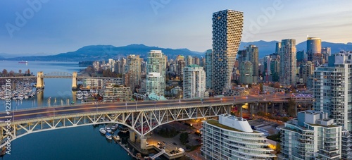 Картината върху платно Vancouver skyline at dawn, featuring the iconic Granville Bridge, modern high-rises, and a vibrant harbor