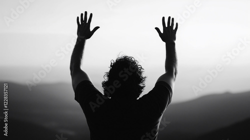 a person who worships the mountain with his hands raised high