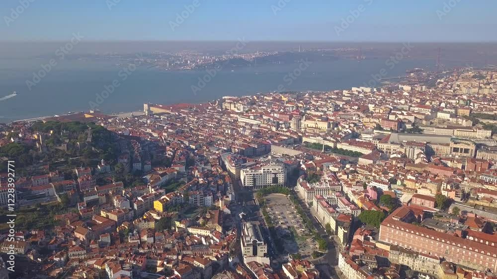 LISBON, PORTUGAL - JANUARY 22, 2025: Aerial view showcasing vibrant architecture and coastline of Lisbon in winter LISBON, PORTUGAL - JANUARY 22, 2025: Aerial view showcasing vibrant architecture and coastline of Lisbon in winter