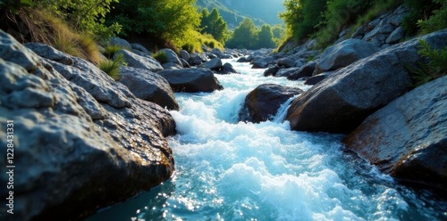 Sparkling blue water rushes over granite rocks, pyrenees mountains landscapes, sparkly mountain water