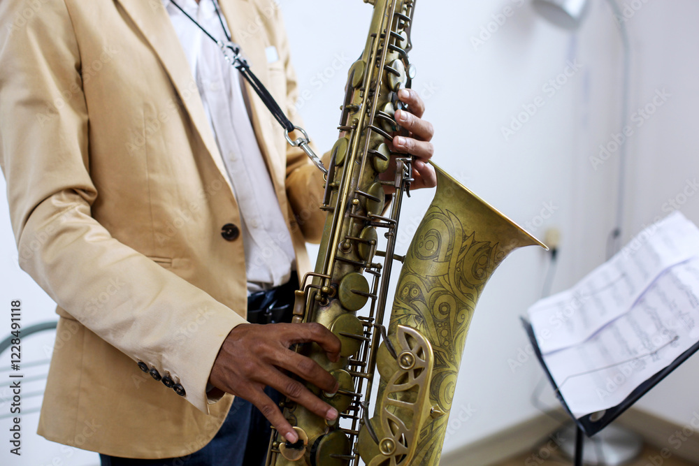 Fototapeta premium Close-up Fingers Pushing The Keys Playing Saxophone 
