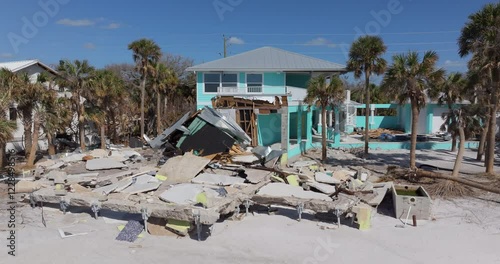 Destroyed houses on ocean coast. Hurricane Milton consequences in Englewood, Florida. Storm surge severe damage. photo