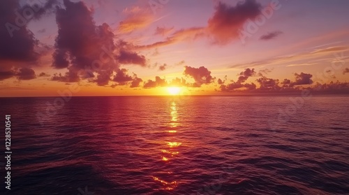 Ocean sunset, vibrant colors, calm waters, travel backdrop