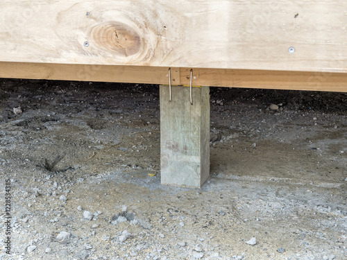 Concrete Pier Supporting Wooden Beam in Deck Foundation Secure Structural Base