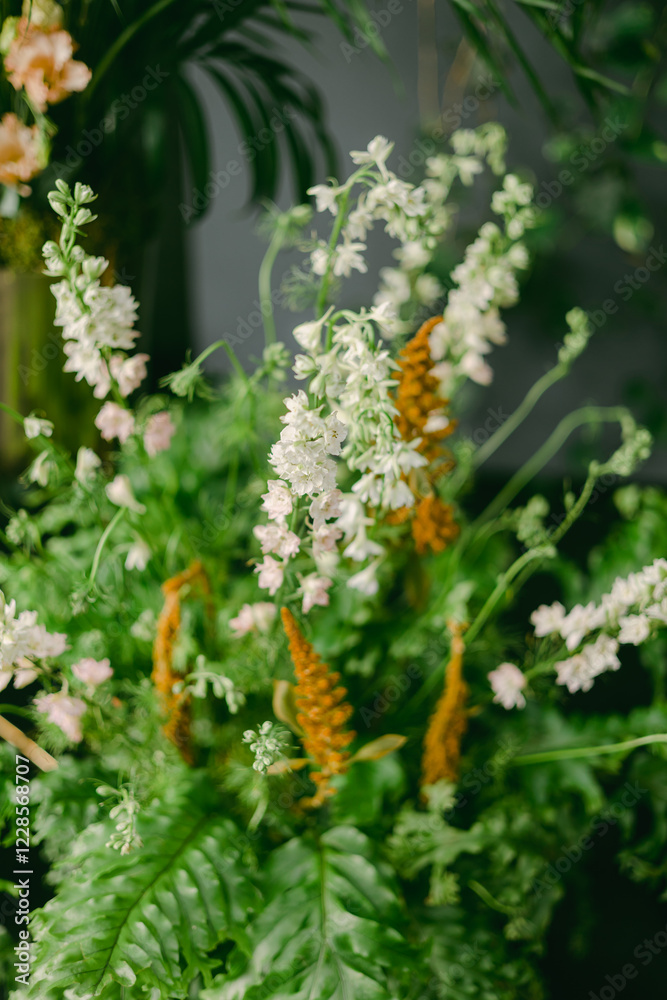 Colorful arrangement of fresh flowers in a vibrant indoor setting showcasing diverse plant life and greenery Colorful arrangement of fresh flowers in a vibrant indoor setting showcasing diverse plant life and greenery