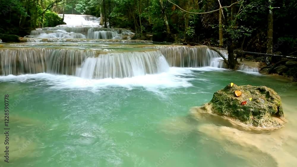 Serene Multi-Tiered Waterfall Cascading Through Lush Green Tropical Forest Serene Multi-Tiered Waterfall Cascading Through Lush Green Tropical Forest