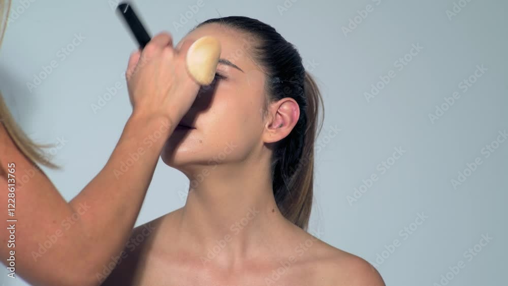 Make-up young woman. Close up visage, cosmetic, mascara. Makeup artist applying foundation skin, blusher and powder. Beautiful woman face. Beauty girl with perfect skin. Make-up young woman. Close up visage, cosmetic, mascara. Makeup artist applying foundation skin, blusher and powder. Beautiful woman face. Beauty girl with perfect skin.