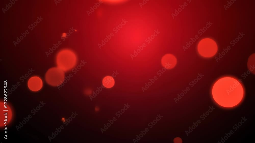 Glowing red bokeh lights shift and transform smoothly across the dark background