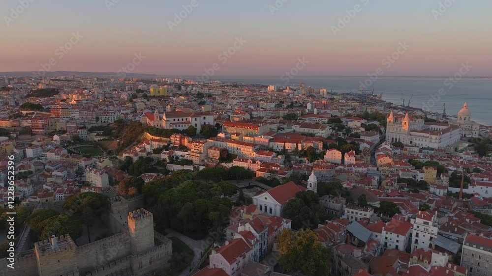 LISBON, PORTUGAL - JANUARY 22, 2025: Stunning aerial view of cityscape showcasing historic landmarks and vibrant neighborhoods at sunset LISBON, PORTUGAL - JANUARY 22, 2025: Stunning aerial view of cityscape showcasing historic landmarks and vibrant neighborhoods at sunset