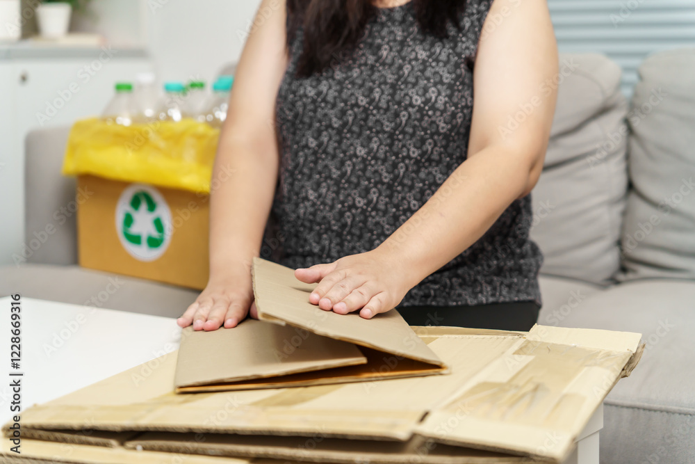 Home recycle eco zero waste concept Woman using recycle paper box. Stacking brown cardboard box eco friendly packaging made of recyclable raw materials. Home recycle eco zero waste concept Woman using recycle paper box. Stacking brown cardboard box eco friendly packaging made of recyclable raw materials.