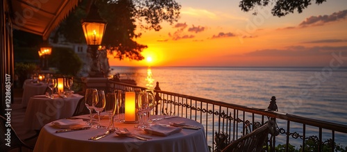 Romantic oceanfront dinner at sunset. photo