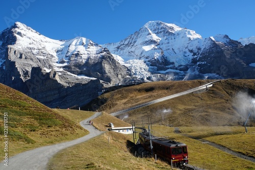 Jungfrau Region landscape with a train - Grindelwald, Switzerland photo