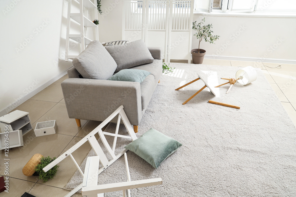 © Pixel-Shot - Sofa with broken table and chair in messy living room
