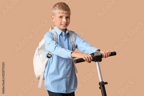 Cute schoolboy with modern ...