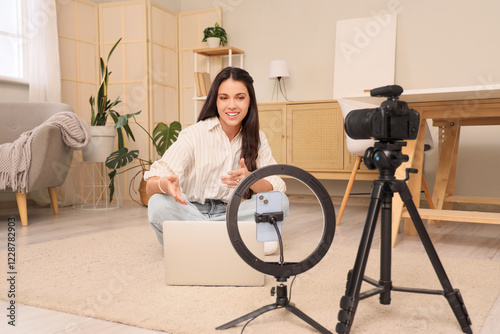 Female blogger with laptop ...