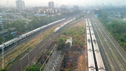 2 trains reached bhayandar station drone following trains wide top view photo