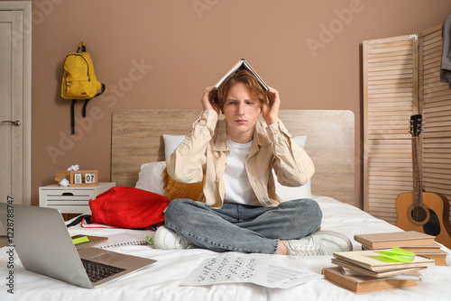 Frustrated male student ove...