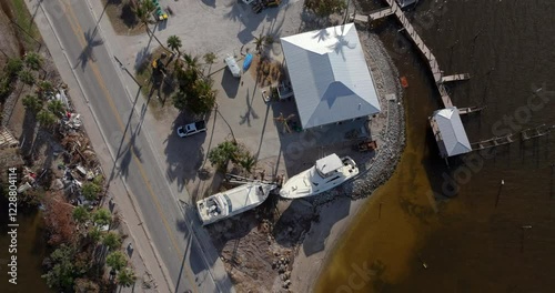 Natural disaster aftermath. Destroyed yachts after hurricane Milton on Manasota Key in Englewood, Florida. photo