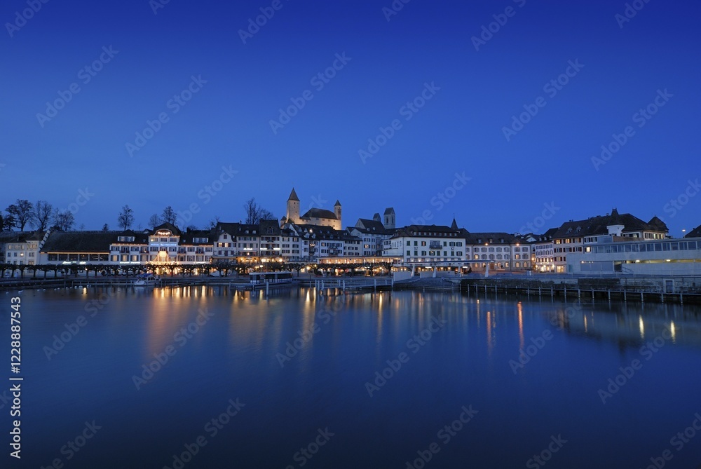 Obraz premium Rapperswil - the promenade and the Rapperswil castle at dawn - Canton of St. Gallen, Switzerland, Europe., Europe