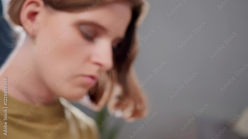 Woman with prosthetic arm typing on laptop Woman with prosthetic arm typing on laptop