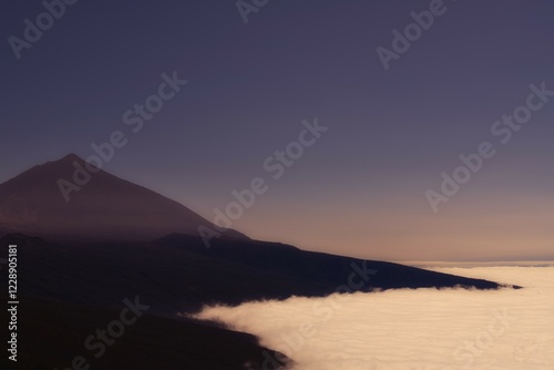 Volcano Pico del Teide above trade winds, dawn, Teide National Park, Tenerife, Canary Islands, Spain, Europe photo