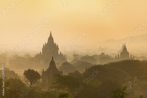 View of pagodas with hot air balloons, temples, sunrise, haze, morning light, Bagan, Division Mandalay, Myanmar, Asia photo