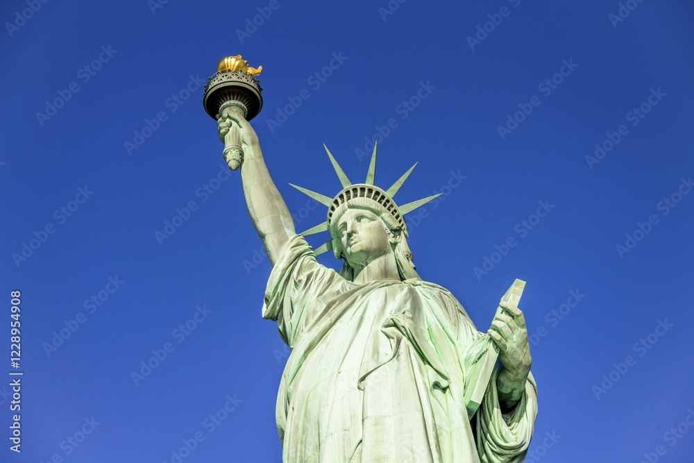 Fototapeta premium Statue of Liberty in front of blue sky, Liberty Island, Statue of Liberty National Monument, New York City, New York, USA, North America