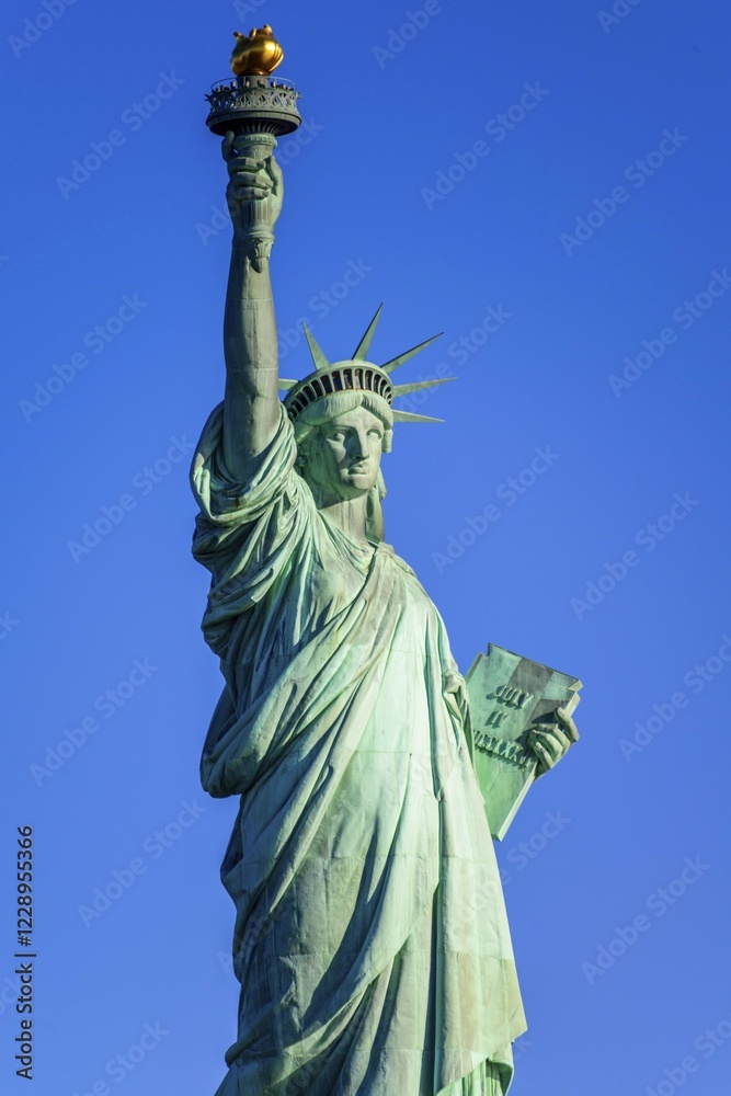 Fototapeta premium Statue of Liberty in front of blue sky, Liberty Island, Statue of Liberty National Monument, New York City, New York, USA, North America
