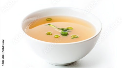 A minimalist bowl of freshly prepared miso soup, served in a plain white ceramic bowl with a few green onions floating on top, Soup centered