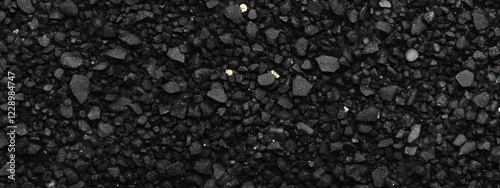 Close-up of dark grey gravel texture. photo