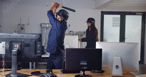 Photos Computer, weapon and friends in rage room for frustrated, anger management and stress relief