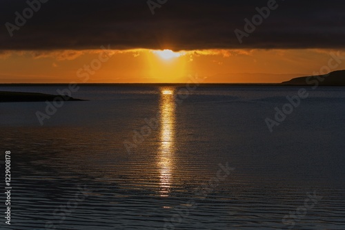 Sunset, sun reflected in the water, near Grundarfjördur, peninsula Snaefellsnes, Iceland, Europe