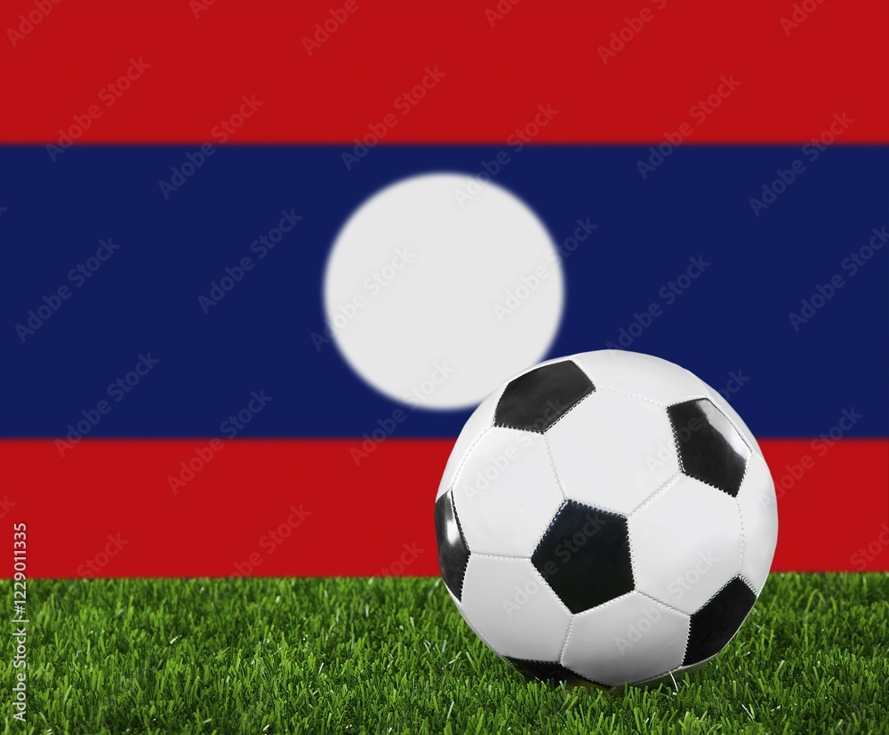 The Laotian flag and soccer ball on the green grass The Laotian flag and soccer ball on the green grass