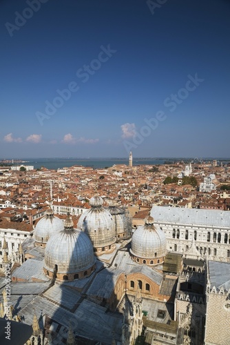 St Mark's Basilica with Romanesque domes and ornate Gothic and Byzantine architectural details plus the Doge's Palace built in the Venetian Gothic architectural style, St Mark's Square, San Marco, Venice, Veneto, Italy, Europe photo