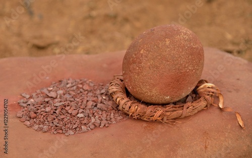 Grinding tool and red iron rocks ​​used for the traditional skin cream of the Himba, Omuramba, Kaokoland, Kunene, Namibia, Africa photo