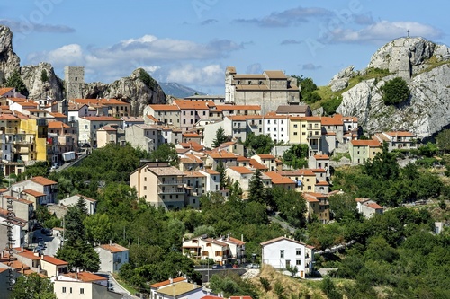 View of mountain village Pietrabbondante with medieval tower and church Chiesa di Santa Maria Assunta on rock Morg Caraceni, Pietrabbondante, Molise, Italy, Europe photo