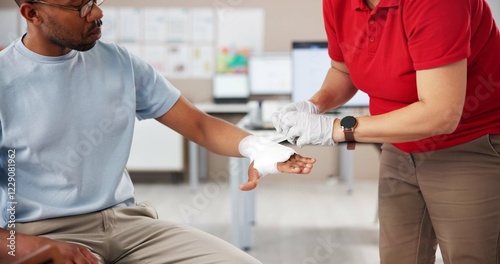 Hands, people and first aid with bandage, teaching or tutorial with care, attention or help at office. Paramedic, coach and staff for treatment, wound or burn injury with training course in workplace photo