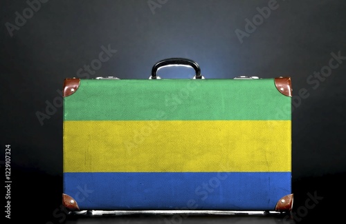 The Gabonese flag on a suitcase for travel