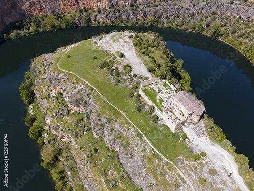 Historic ruin on a rocky hill with river in the background and lush vegetation, aerial view, gorge, Natural Park of the Gorges of the River Duratón, Duraton, Parque Natural de las Hoces del Río Duratón, Ermita de San Frutos, Segovia, Valladolid, Castile and Leon, Spain, KI generated, AI generated, Europe photo