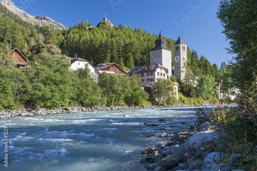 Obraz na płótnie River Inn, medieval Plantaturm Tower with house and Reformed church, above Fortezza Rohan fortress, Susch, Zernez, Grisons, Switzerland, Europe w salonie