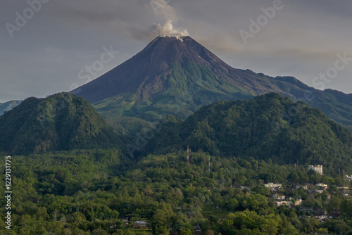 Close-up of Mount Merapi, exuding raw power and beauty, with dramatic skies framing its peak photo