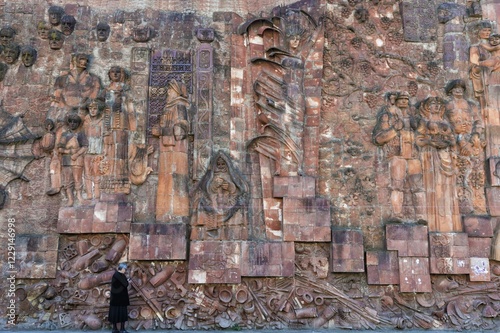 Close-up of faces from communist era on façade of city market, Kutaisi, Imereti Region, Georgia, Asia