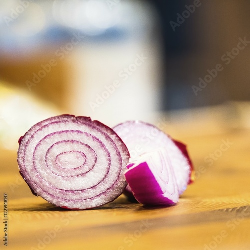 Wooden board with cut red onion and knife on dark background, generative ai photo