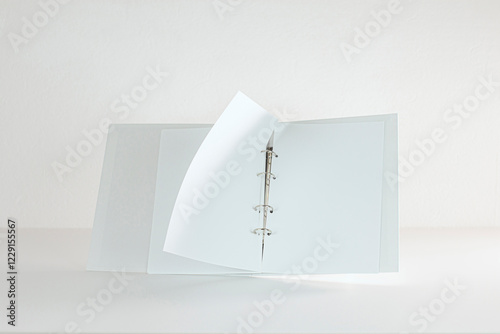 White Folder With Sheets Of Paper Turns Over