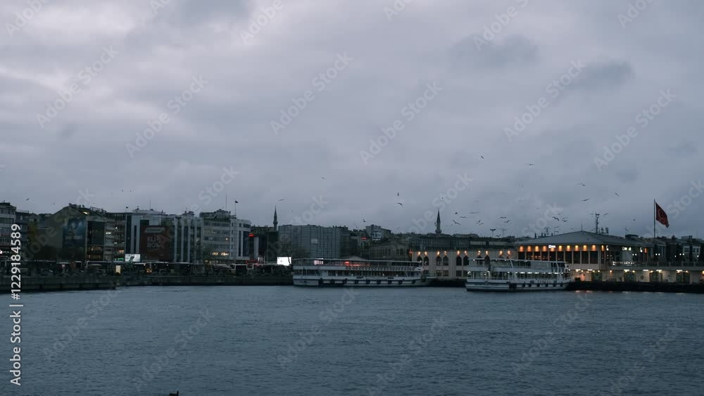 Istanbul, Turkiye - December 3, 2023. Beautiful view of passenger ferry sailing in bosphorus, carrying people between Asian and European parts of Istanbul. Istanbul, Turkiye - December 3, 2023. Beautiful view of passenger ferry sailing in bosphorus, carrying people between Asian and European parts of Istanbul.
