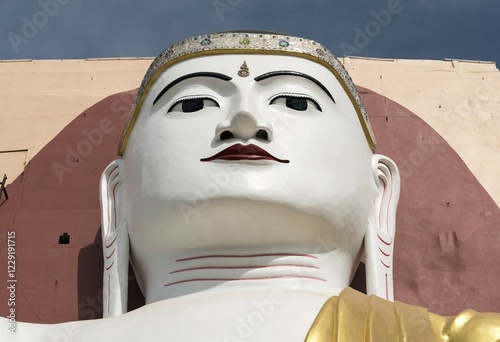 Face of a Buddha statue, Four Seated Buddha Shrine, at Kyaikpun Pagoda in Bago, Burma, Myanmar, Asia photo