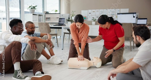 First aid, cpr training and group with dummy for safety compliance, health and chest compression for breathing. Paramedic course, learning and teaching people emergency rescue technique in office photo