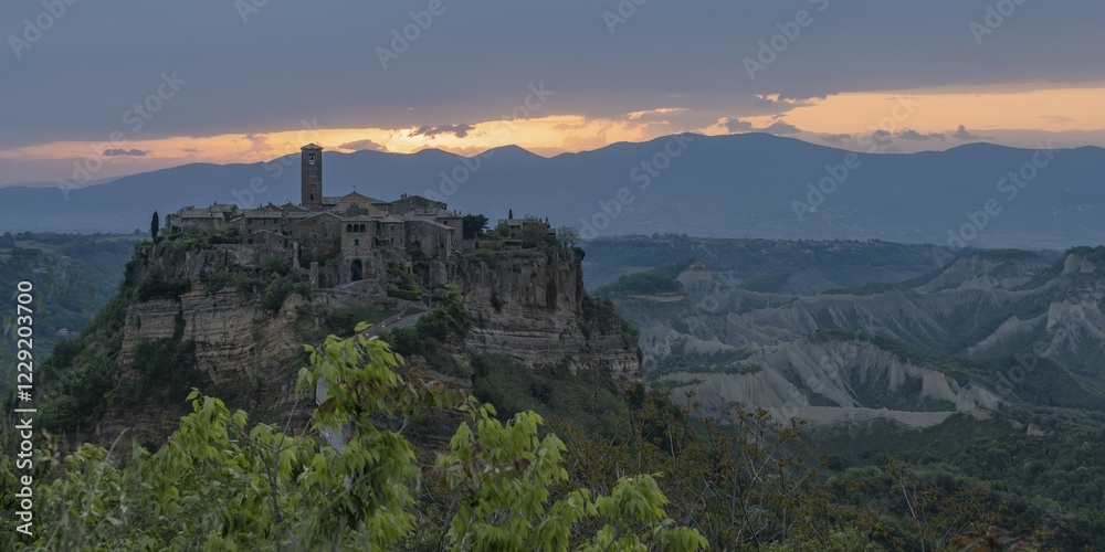 Fototapeta premium The mountain village of Civita di Bagnoregio in hilly landscape at sunrise, Civita di Bagnoregio, Lazio, Italy, Europe